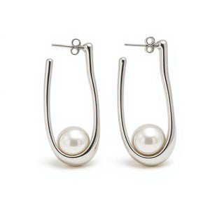 Silver hoop earrings with pearls on a white background
